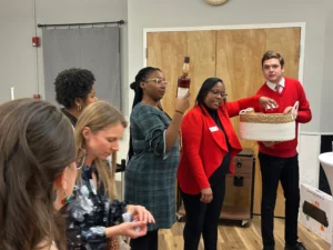 Fundraising event with attendees raising hands in support