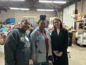 Charity team presenting a donation to a local food bank
